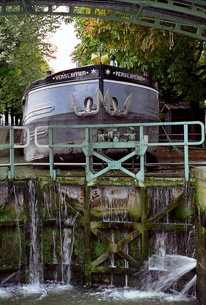 A barge descending the locks of bassin des Récollets on canal Saint-Martin.