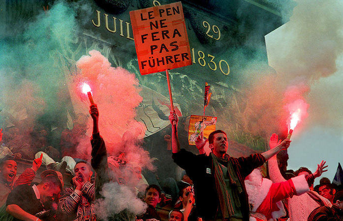 Youths protesting Le Pen’s electoral results on the Column of July.