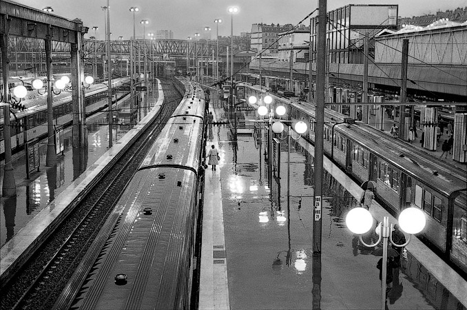 Train platforms at gare du Nord on a rainy day.