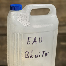 A half-gallon jug of holy water in Saint-Séverin Church.