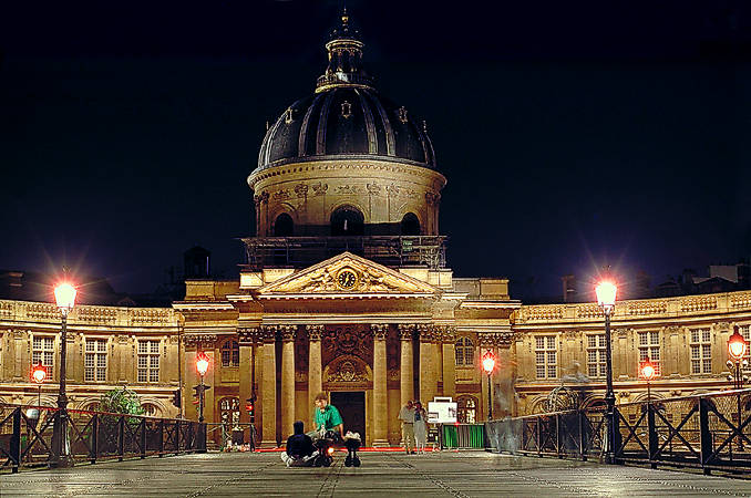 L’Institut de France and pont des Arts at night.