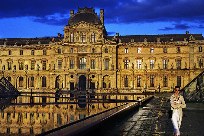 The Louvre Museum’s cour Napoléon at sunset.
