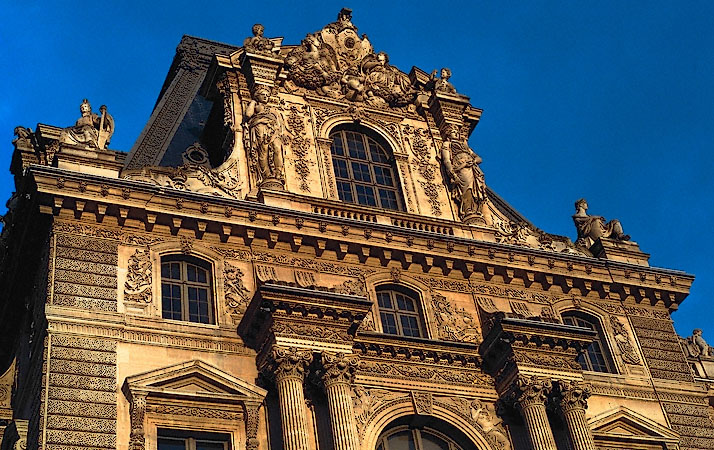 The mansard roof of the Louvre Museum’s Richelieu Wing at sunset.