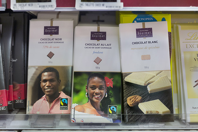 Packages of black chocolate, milk chocolate and white chocolate in a Monoprix supermarket.