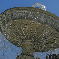 Water gushing from a fountain in place des Vosges