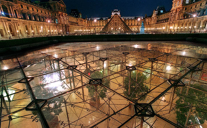An exterior view of the Inverted Pyramid, the Carrousel du Louvre’s skylight at night.