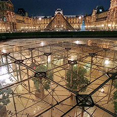 An exterior view of the Inverted Pyramid, the Carrousel du Louvre’s skylight at night.