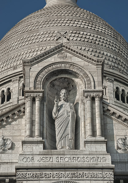 The statue of Jesus Christ on the main façade of Basilica Sacré-Cœur.