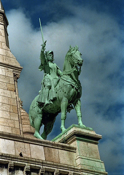 The bronze equestrian statue of Joan of Arc in front of Sacré-Cœur.