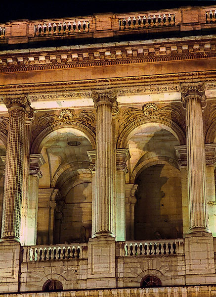 The top-central portion of Saint-Sulpice Church’s main façade at night.