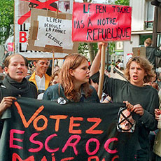 Teenagers protesting against the Front National on boulevard Richard-Lenoir with a banner reading «Votez escroc mais pas facho».