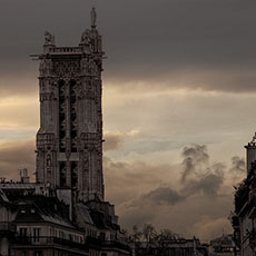 The Saint-Jacques Tower and rue de Rivoli at sunset.