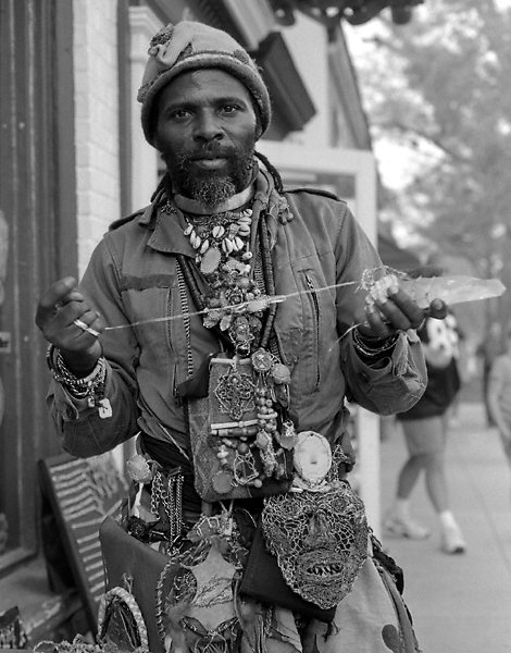 A man selling crystal jewelry in Chapel Hill.