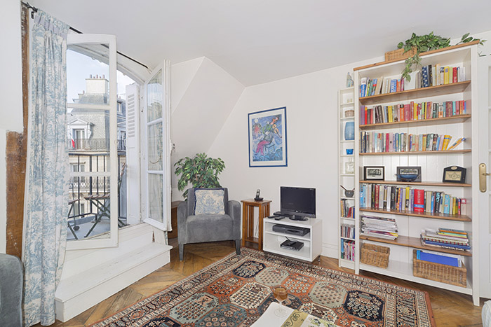The apartment living area looks out onto the street and the bedroom is courtyard side. The famous rue Montorgueil pedestrian street with lots of cafes, restaurants and food shops is just around the corner.
