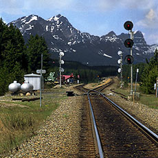 Train tracks head west out of Banff, Alberta, bound for the Pacific Coast.
