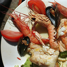 Crawfish, mussels, and other kinds of seafood in a salad typically served in Cannes.