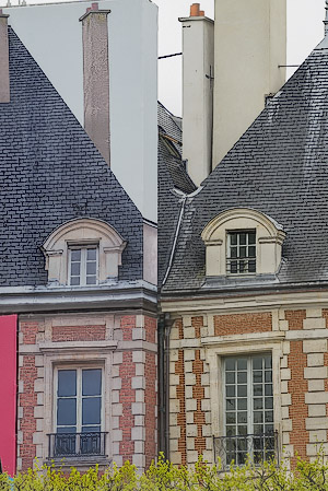 A classic mistake in white balance in a photograph printed far too blue and red in place des Vosges.