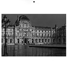 Black and white photographs of the Louvre museum and the Eiffel Tower.