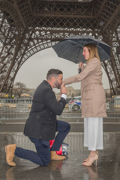Manny Sagot proposing marriage under the Eiffel Tower.