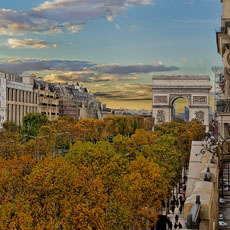 The eastern façade of l’Arc de Triomphe and les Champs-Élysées in the fall.