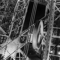 Iron girders, pulleys and cables inside the Eiffel Tower.