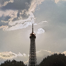The sun directly behind the top level of the Eiffel Tower.