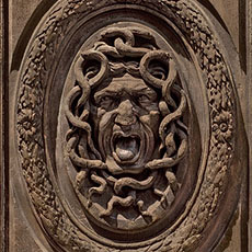 A Medusa head on a door of the hôtel Amelot de Bisseuil.