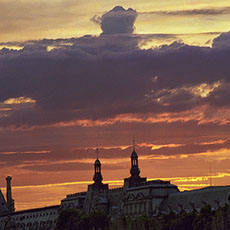 A sunset over the Louvre Museum, seen from pont Neuf.