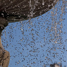 Water falling in a fountain in place des Vosges.