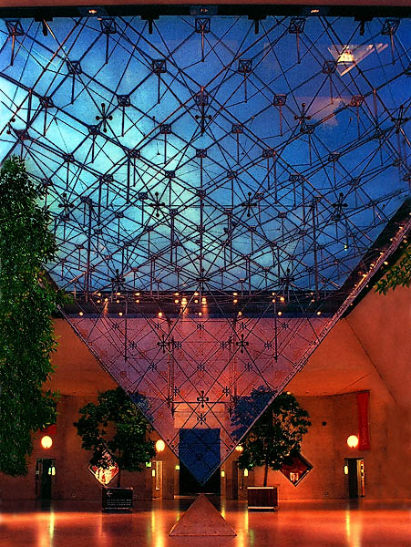 The Carrousel du Louvre’s Inverted Pyramid at night.