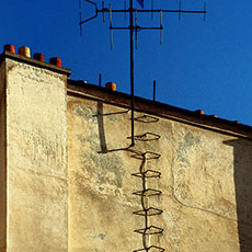 Shadows of a ladder on a chimney on rue Vieille-du-Temple.