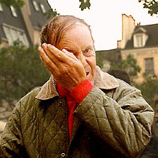A man wiping snot out of his nose in place Joachim-du-Bellay.