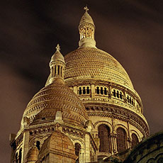The domes of Sacré-Cœur at night.
