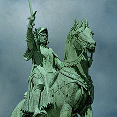 The bronze equestrian statue of Joan of Arc in front of Sacré-Cœur.