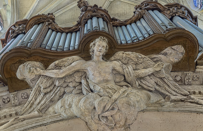 An angel below the organ pipes in Saint-Gervais Church.