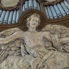 An angel below the organ pipes in Saint-Gervais Church.