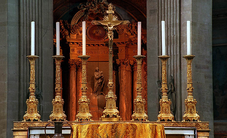 Six candle holders on the alter of Saint-Sulpice Church.