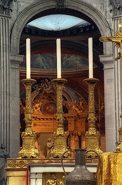 Three candle holders on the high altar at Saint-Sulpice Church.