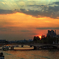 A sunset on the pont du Carrousel, le Grand Palais and the Louvre museum.