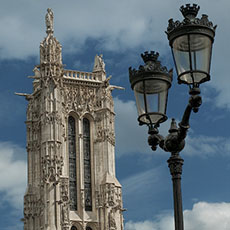 A classic Parisian streetlight and the western side of Tour Saint-Jacques.