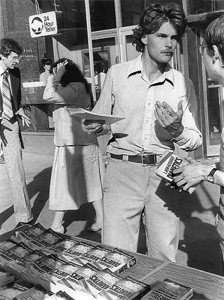 A man selling Dianetics books on Tremont Street in Biston.