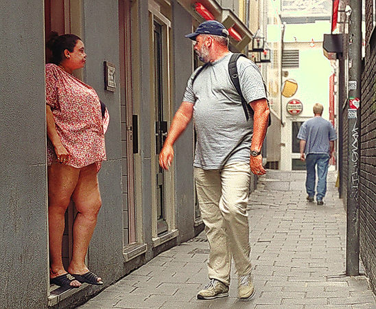 A man and a woman in Amsterdam’s Red Light district