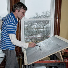 James Hobin working on lithographs of images of his Savin Hill neighborhood in his studio in Dorchester.