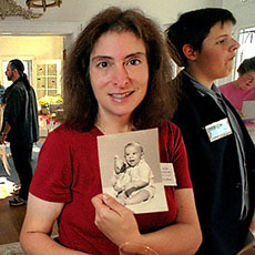 Arnold Engel with his daughter Lee Buchanan, who is holding a picture of Edward Engel when he was a baby