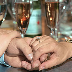 Irina and Michael Dolan admire their engagement ring in the «Altitude 95» restaurant on the Eiffel Tower, July 12th 2006.