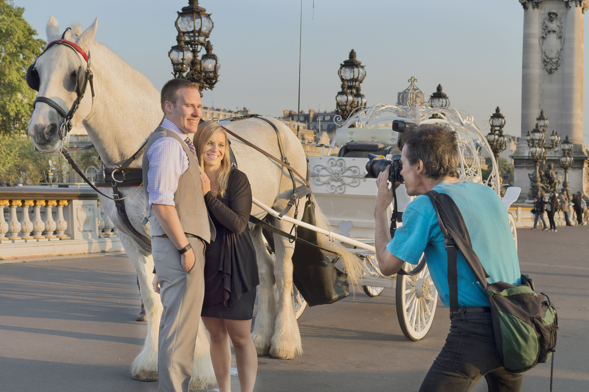 David Henry photographing a couple on pont Alexandre III in Paris.